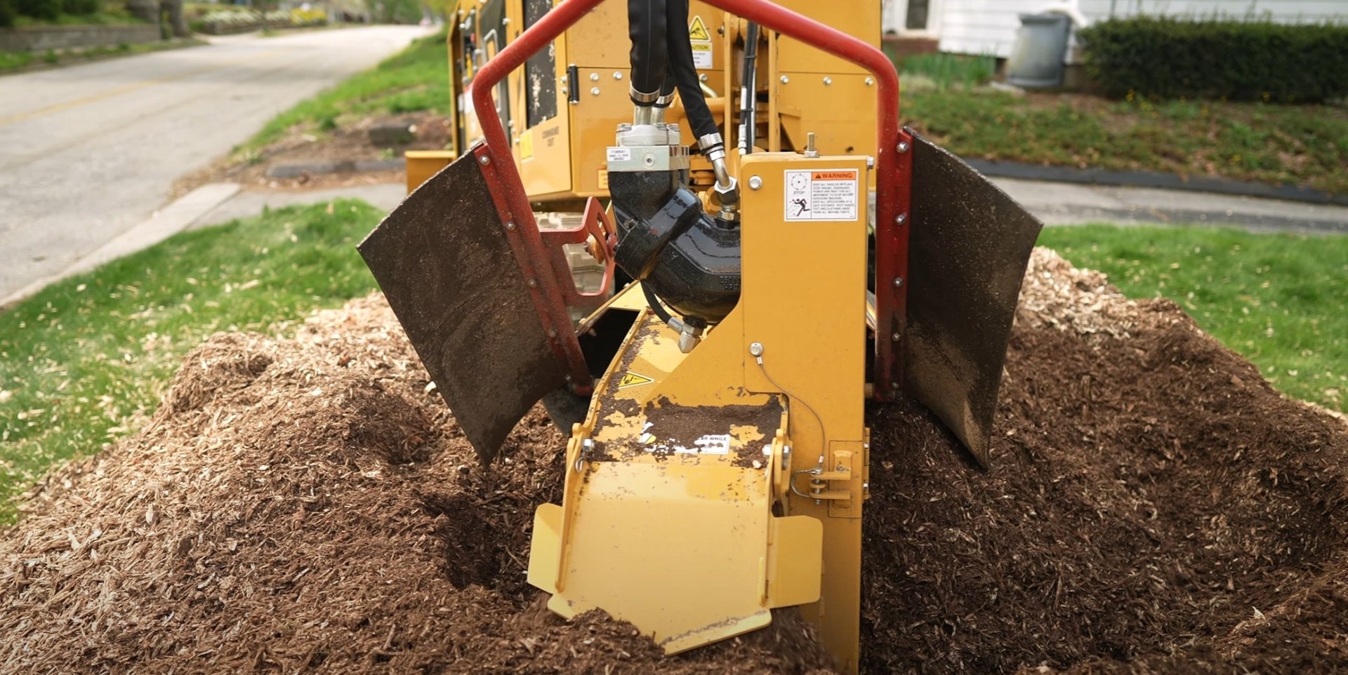 Complete stump grinding service for yard restoration Professional stump grinding equipment removing tree stumps to prepare yard for new landscaping